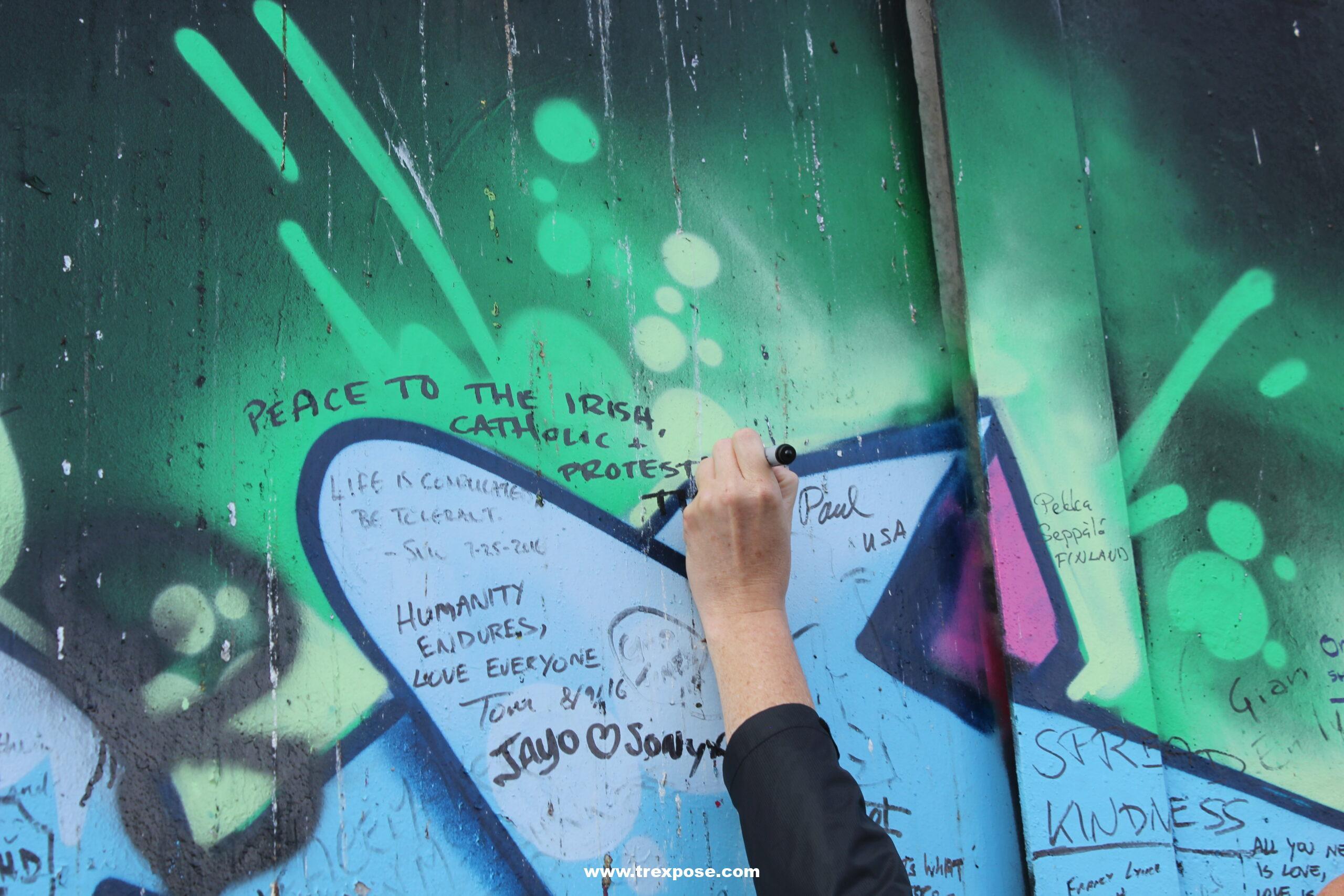 Writing on a peace wall in Belfast, Northern Ireland.